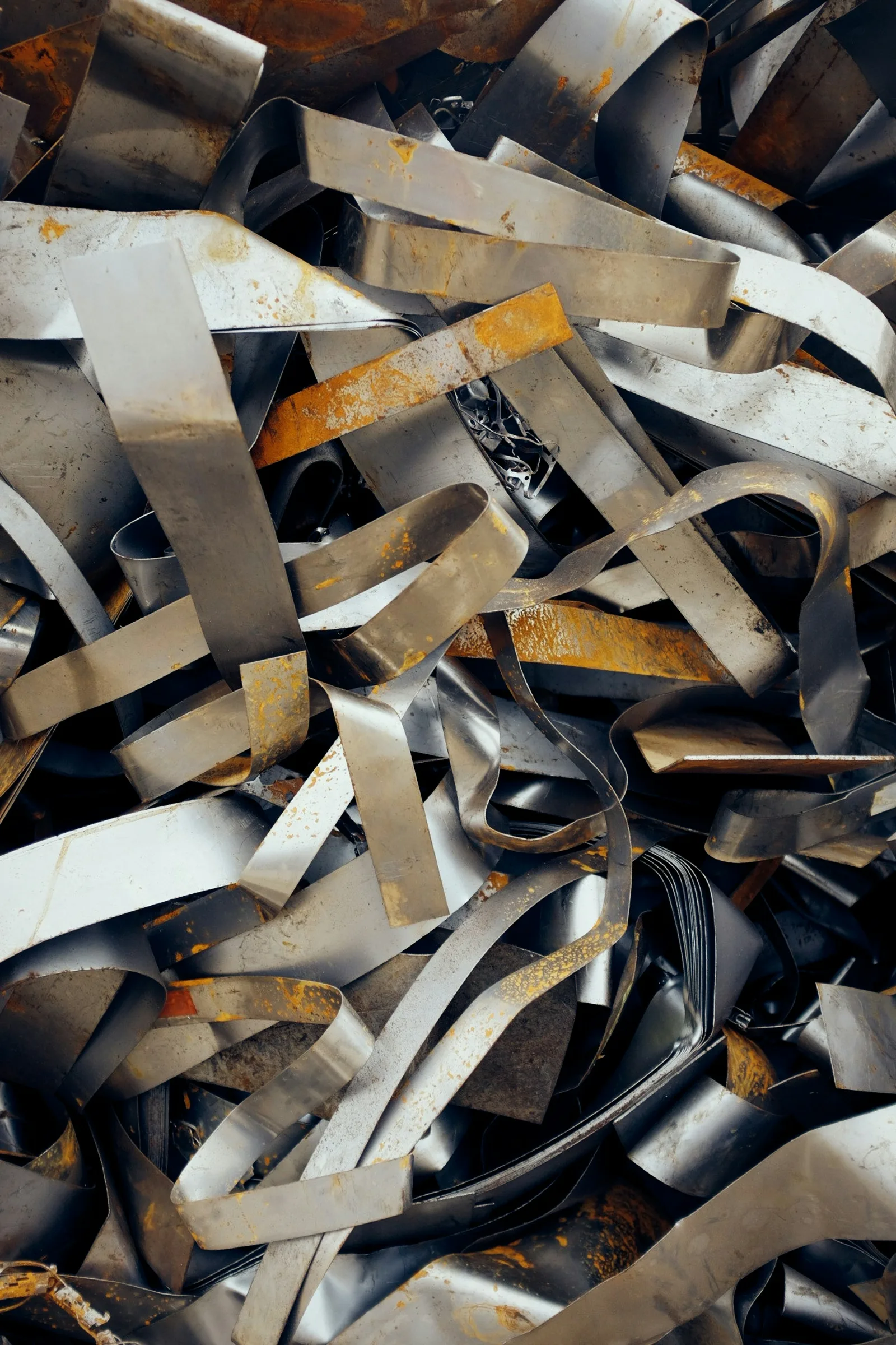 Piles of all types of scrap metal in a yard