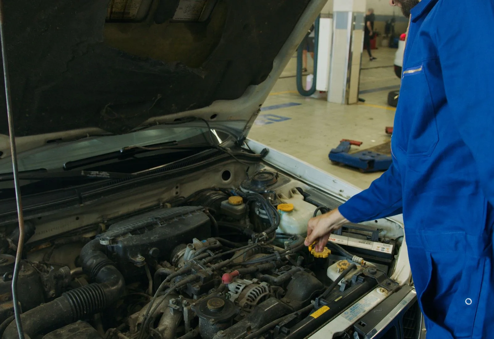 Mechanic working on a car engine